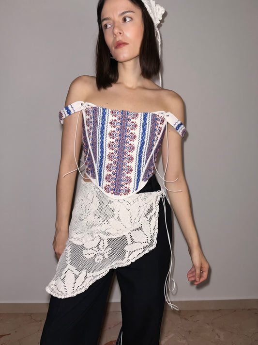 Folk corset with red and blue geometric motifs